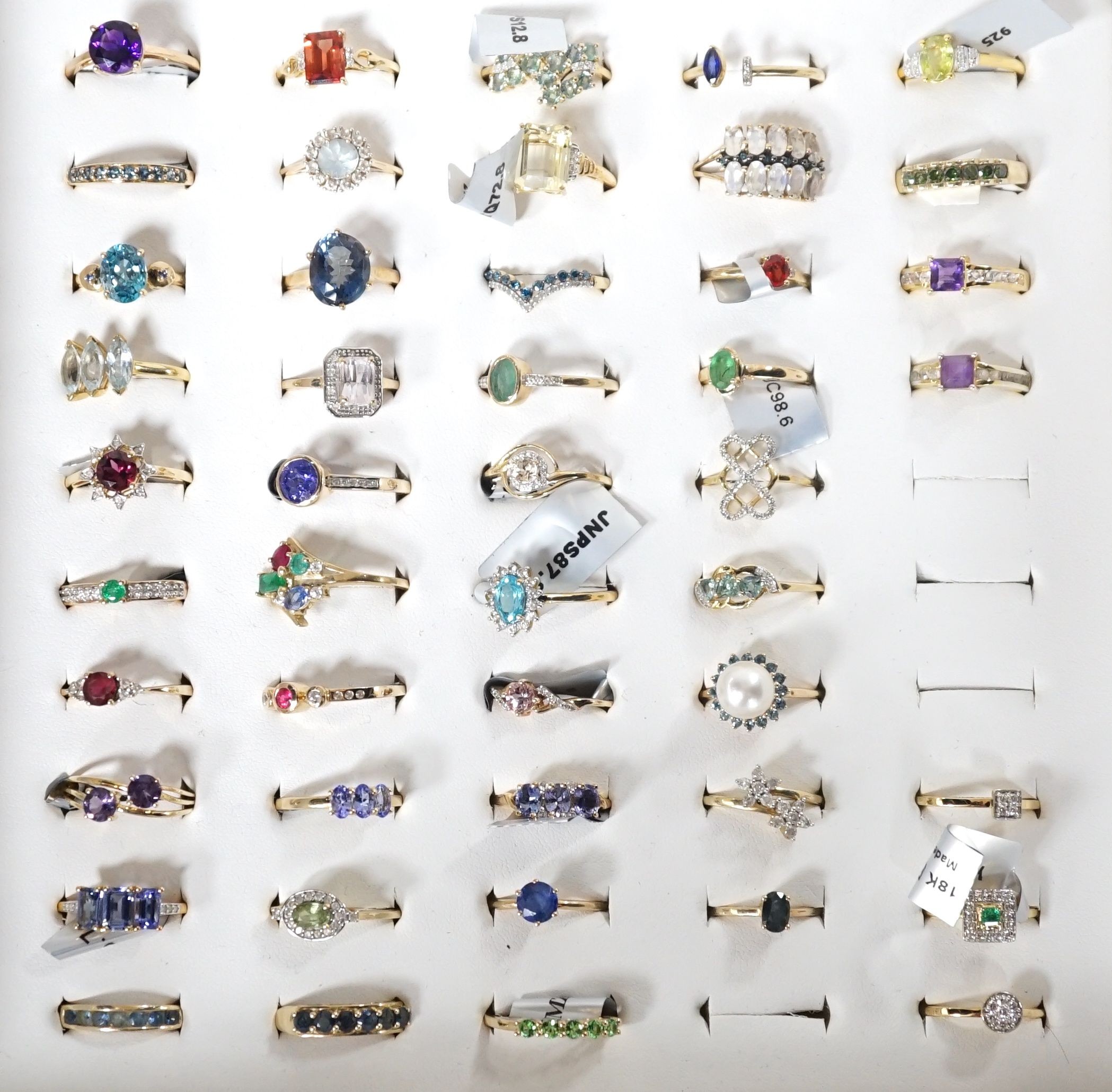 A collection of thirty nine assorted modern 9ct gold and gem set rings including amethyst, cultured pearl and emerald, three 18ct gold and gem set rings including two diamond clusters and an emerald and diamond cluster a
